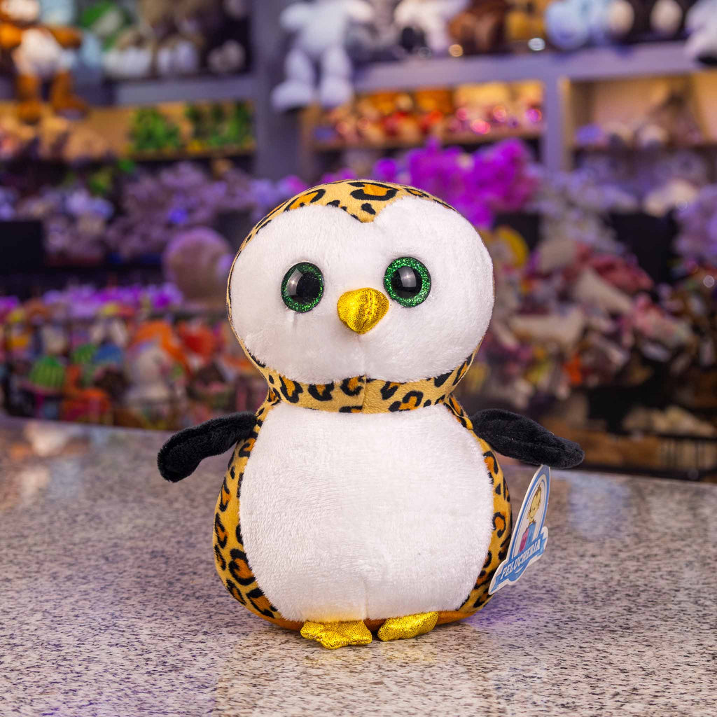 Búho de peluche con detalles brillantes y colores. Ideal para mayoristas y distribuidores. Peluches para maquinas 