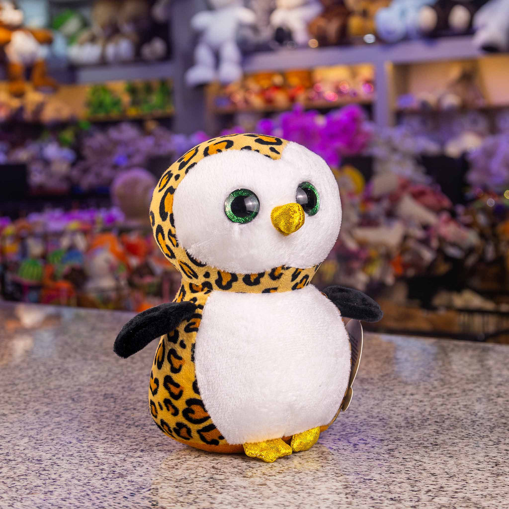 Búho de peluche con detalles brillantes y colores. Ideal para mayoristas y distribuidores. Peluches para maquinas 