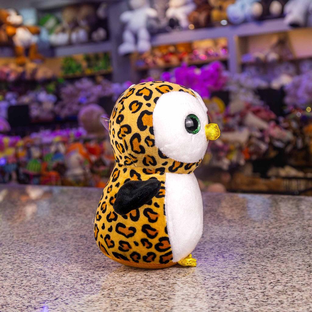 Búho de peluche con detalles brillantes y colores. Ideal para mayoristas y distribuidores. Peluches para maquinas 