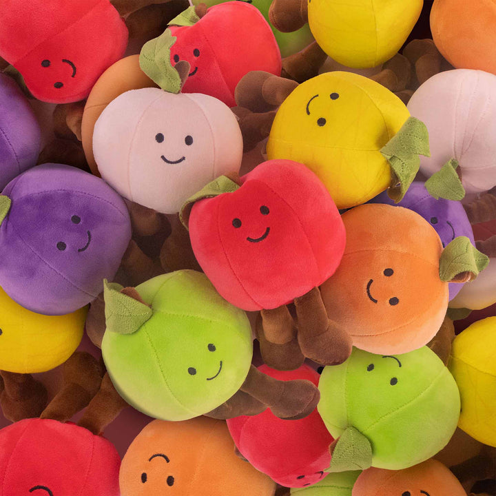 Frutas y comida de peluche al mayoreo. Colores surtidos con caritas felices 