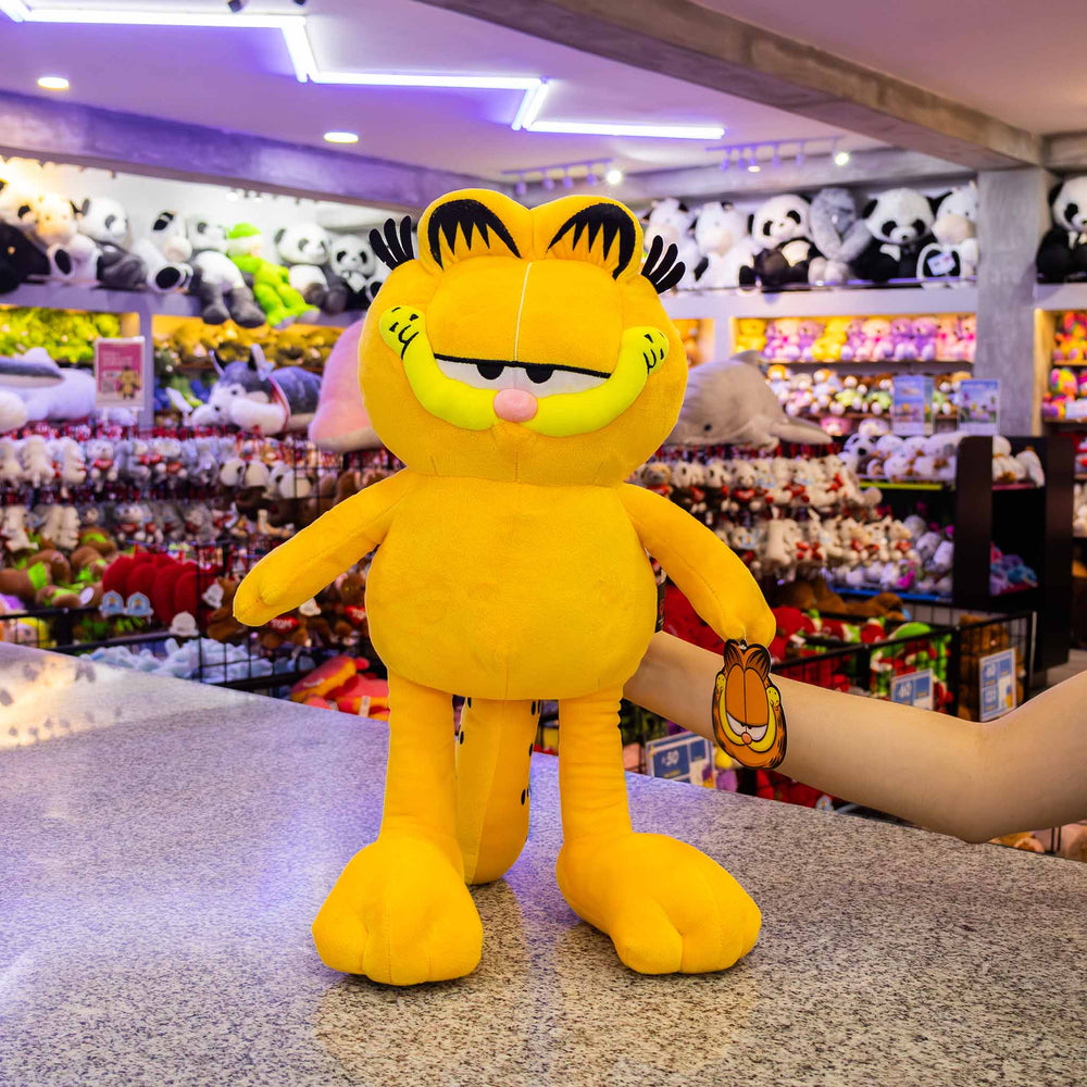 Garfield de peluche original. Peluches de licencias, color naranja con negro