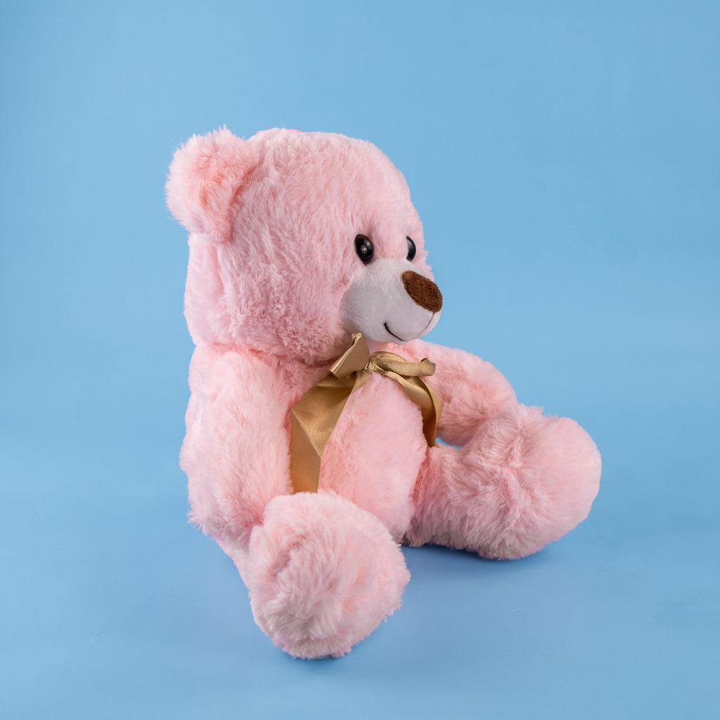Oso de peluche color rosa con moño decorativo, ideal para regalos, baby showers o eventos.