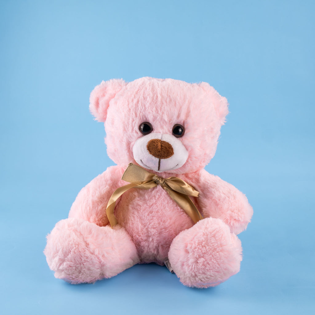 Oso de peluche color rosa con moño decorativo, ideal para regalos, baby showers o eventos.
