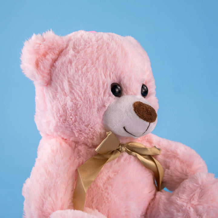 Osos de peluche color rosa con moño dorado. Peluches al mayoreo