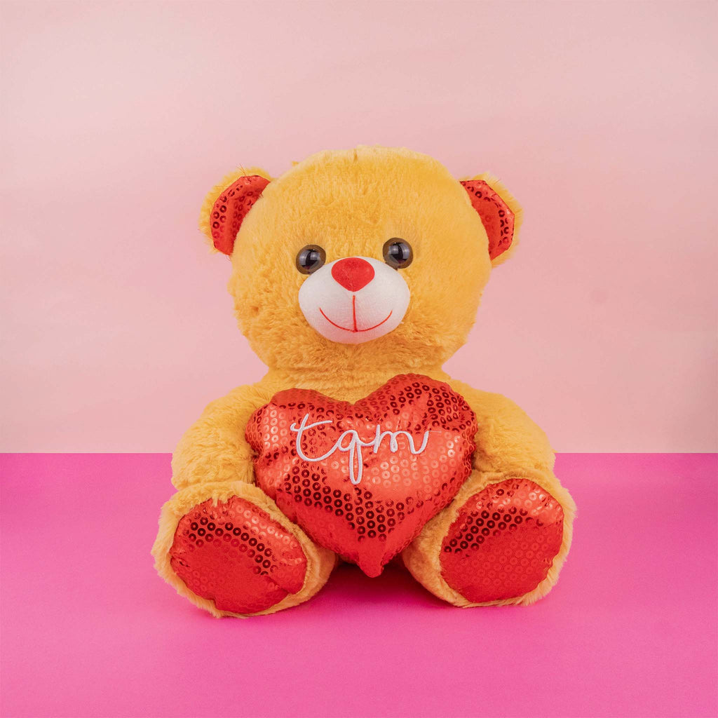 Oso de peluche con corazón ideal para San Valentín , suave y abrazable . Tiendas de regalos y distribuidores 