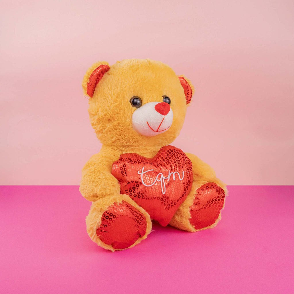 Oso de peluche con corazón ideal para San Valentín , suave y abrazable . Tiendas de regalos y distribuidores 
