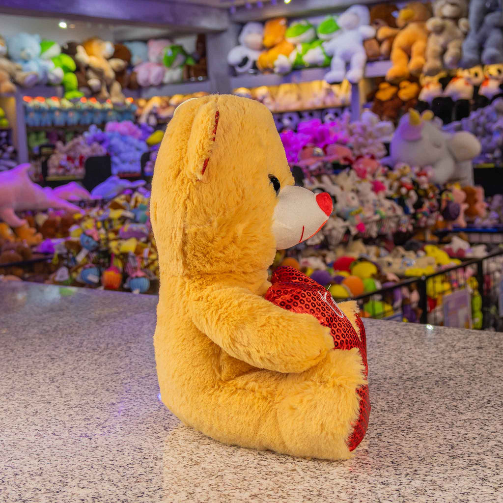 Oso de peluche con corazón ideal para San Valentín , suave y abrazable . Tiendas de regalos y distribuidores 