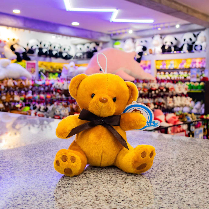 Osos de peluche al mayoreo en colores blanco y café, perfectos para decoración y eventos