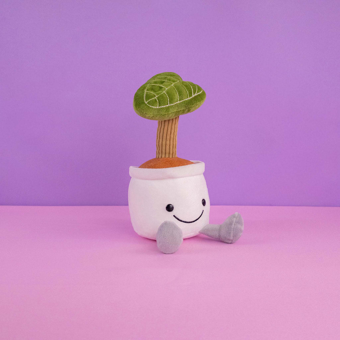 Planta de peluche Kumba 23 cm PIUINIKI - Pelucheria. Peluche de planta con carita feliz en color verde