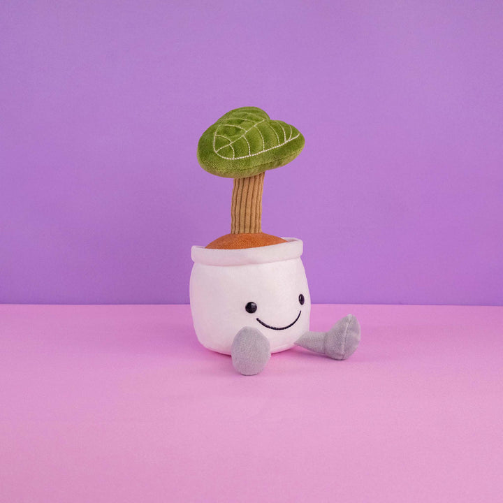 Planta de peluche Kumba 23 cm PIUINIKI - Pelucheria. Peluche de planta con carita feliz en color verde