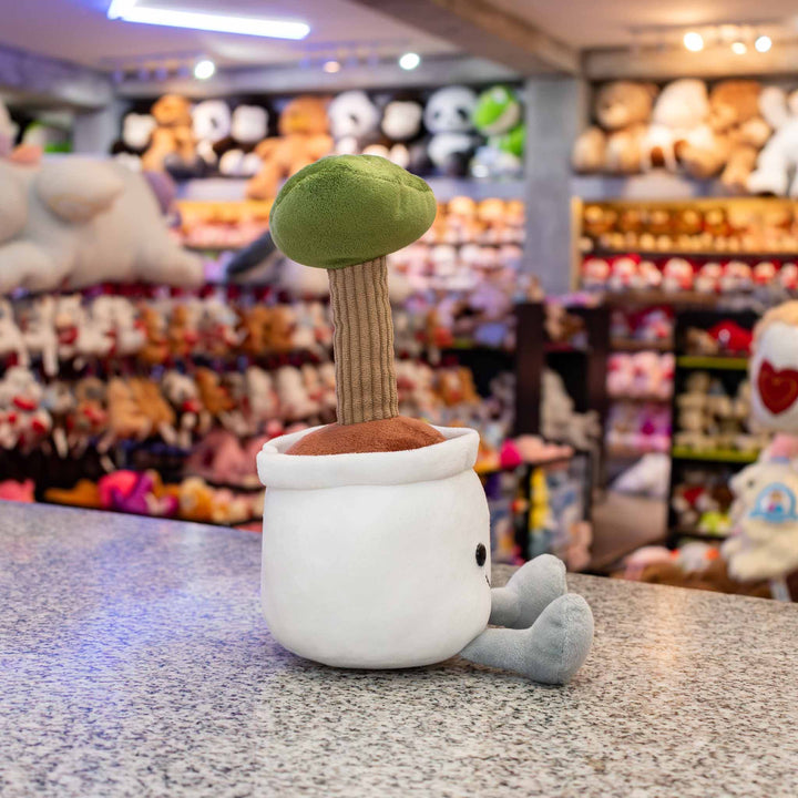 Planta de peluche Kumba 23 cm PIUINIKI - Pelucheria. Peluche de planta con carita feliz en color verde