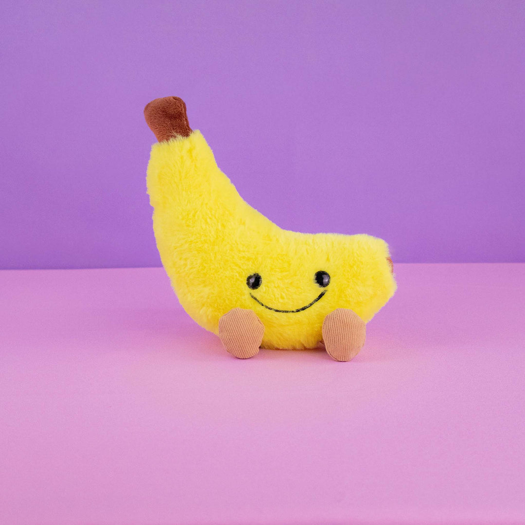 Plátano de peluche Nana 18 cm PIUINIKI, color amarillo con carita feliz