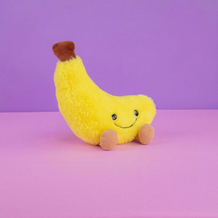 Plátano de peluche Nana 18 cm PIUINIKI, color amarillo con carita feliz