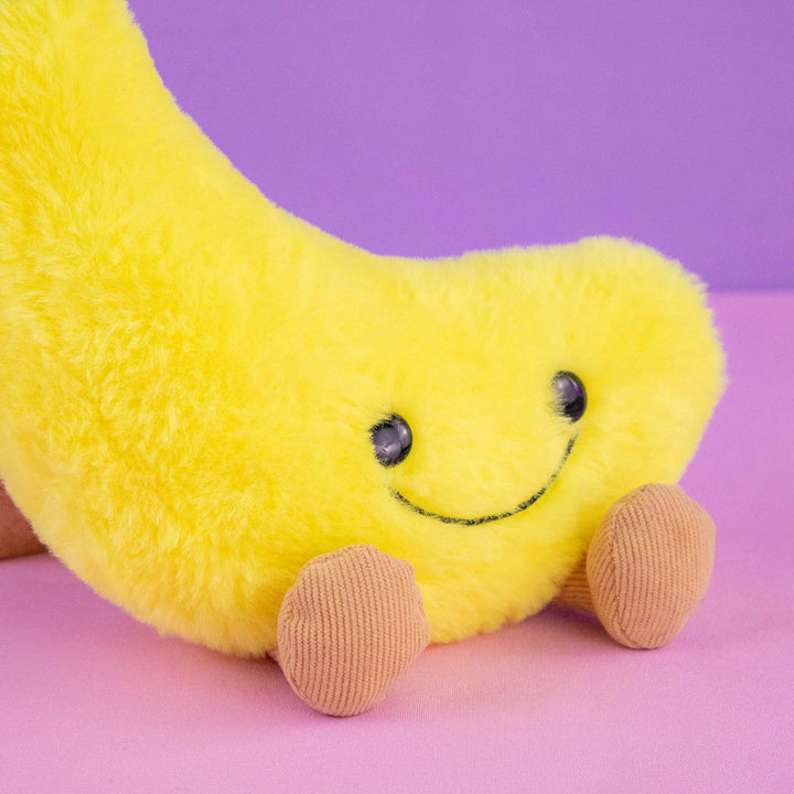 Plátano de peluche Nana 18 cm PIUINIKI, color amarillo con carita feliz