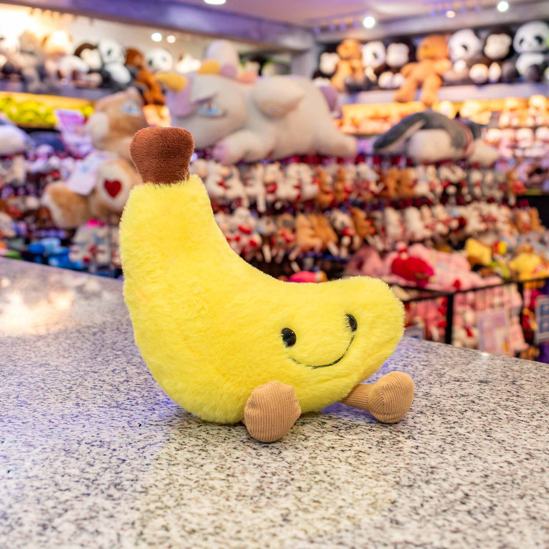 Plátano de peluche Nana 18 cm PIUINIKI, color amarillo con carita feliz
