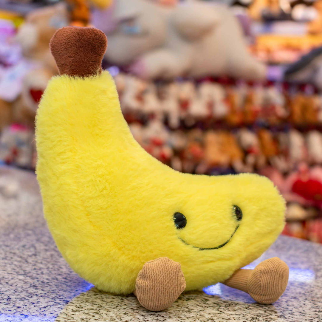Plátano de peluche Nana 18 cm PIUINIKI, color amarillo con carita feliz