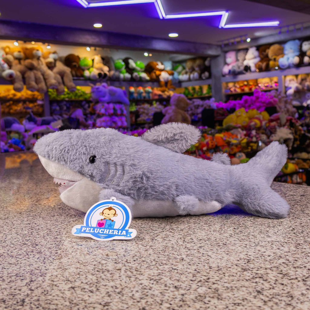 Tiburón de peluche  con detalles brillantes. Ideal para distribuidores. Variedad y materiales de calidad