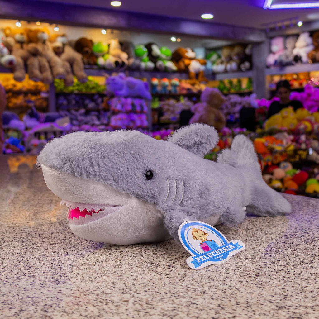 Tiburón de peluche  con detalles brillantes. Ideal para distribuidores. Variedad y materiales de calidad