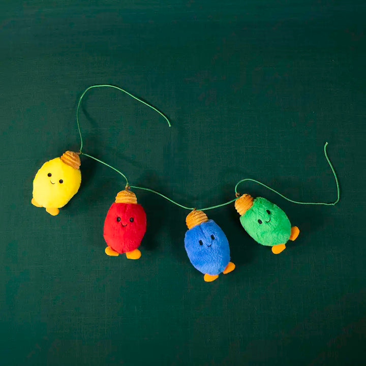 Paquete de 4 piezas Foquitos navideños luces de peluche 11 cm